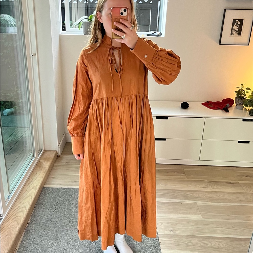 A Bronze Age house dress in burnt orange colour